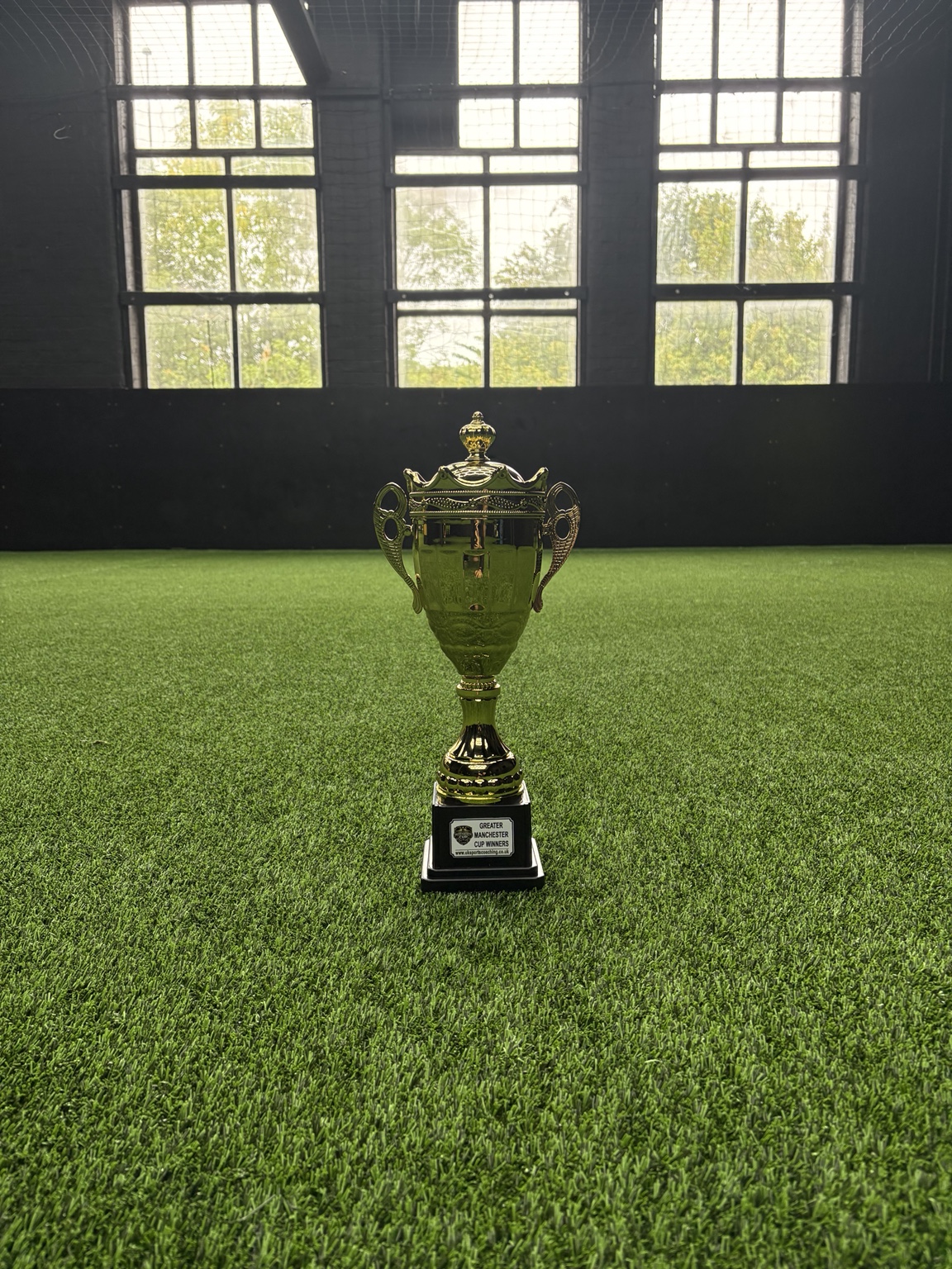 Greater Manchester Cup trophy on the UK Sports Arena pitch