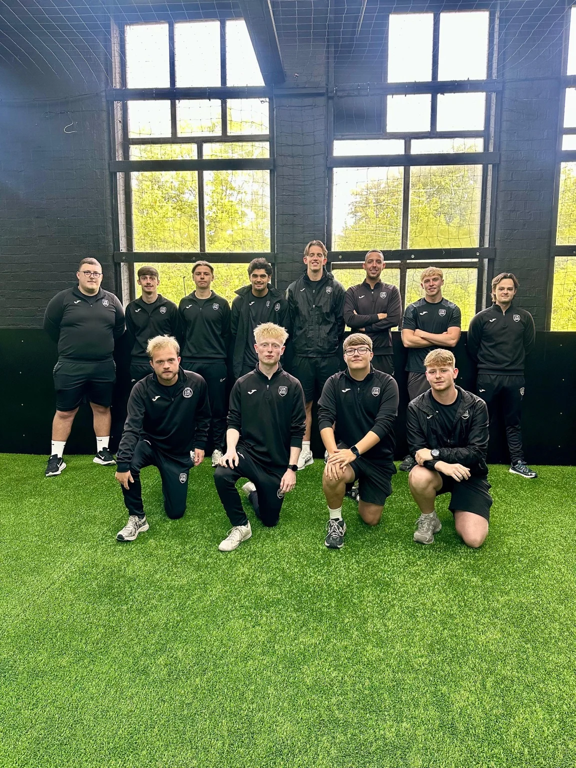 UK Sports Coaching Ltd staff team standing together at the UK Sports Arena